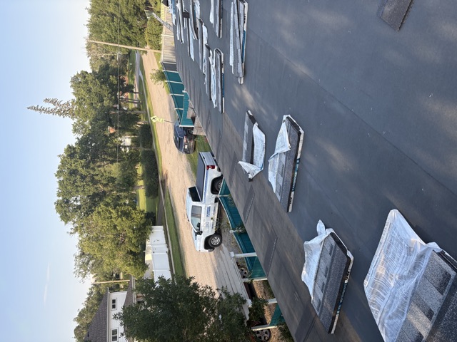 Shingle bundles staged on a roof