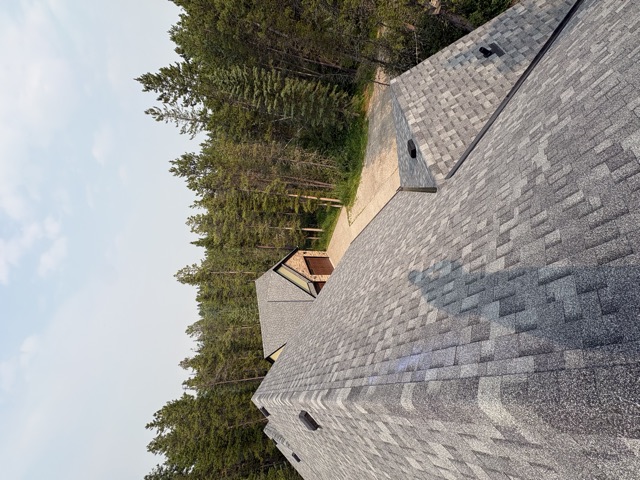 House and detached garage roofs, gravel drive