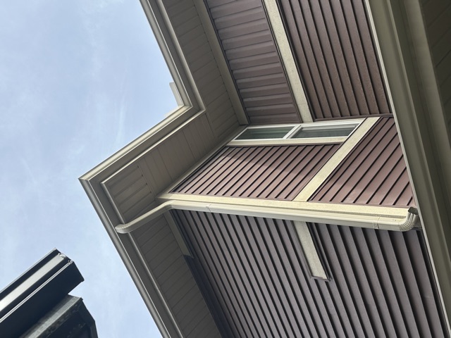 Eavestrough, fascia and soffit at a roof corner