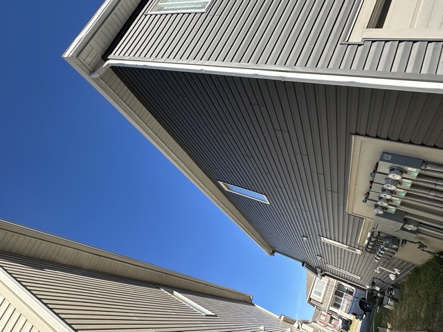 Grey siding on a tall side wall