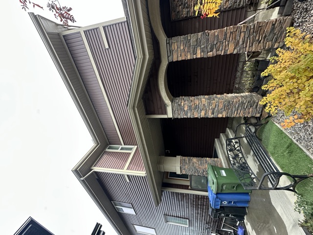 Dark siding and stone at a front entry